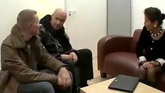 German Mature Woman Handles Two Cocks In Office Setting