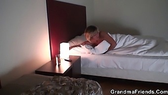 A Mature Blonde Grandma Enjoys Two Young Cocks In Her Mouth