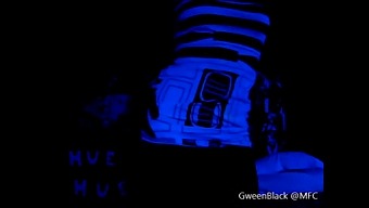 Dancing Provocatively In Black Light With His Rear End Exposed